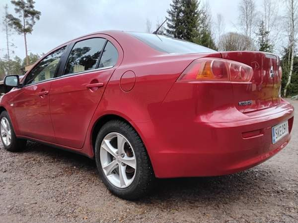 Mitsubishi Lancer Раума - изображение 5